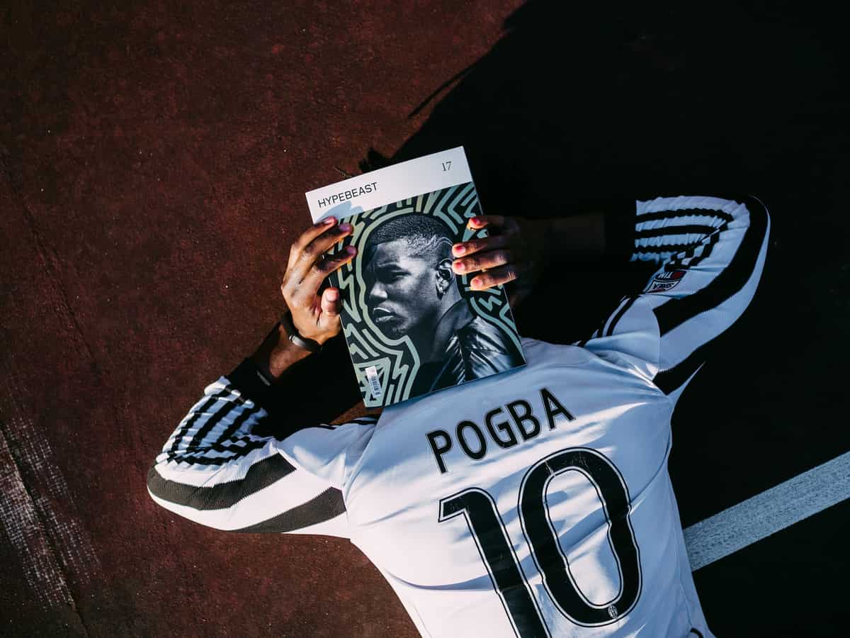 A football fan wearing a Paul Pogba Juventus shirt.