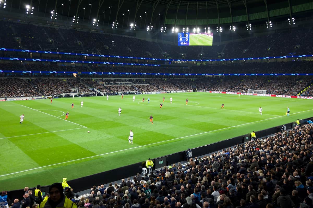 Football match taking place at the Tottenham Hotspur Stadium.