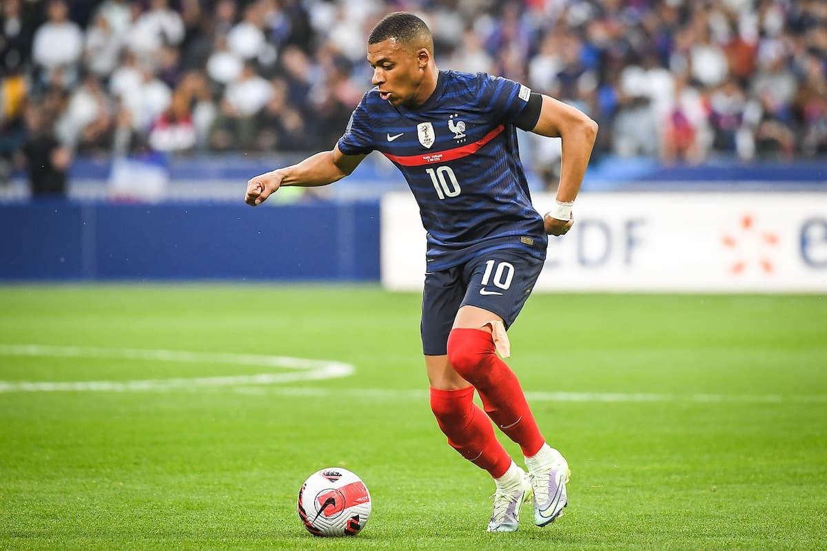 Kylian Mbappé dribbling with the ball whilst playing for France.