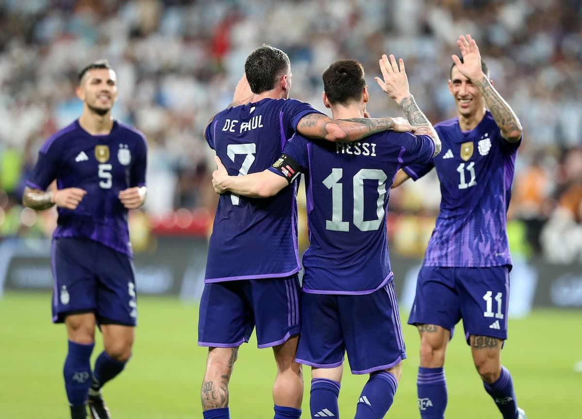 Lionel Messi celebrating a goal for Argentina with teammates Rodrigo De Paul, Ángel Di María and Leandro Paredes.